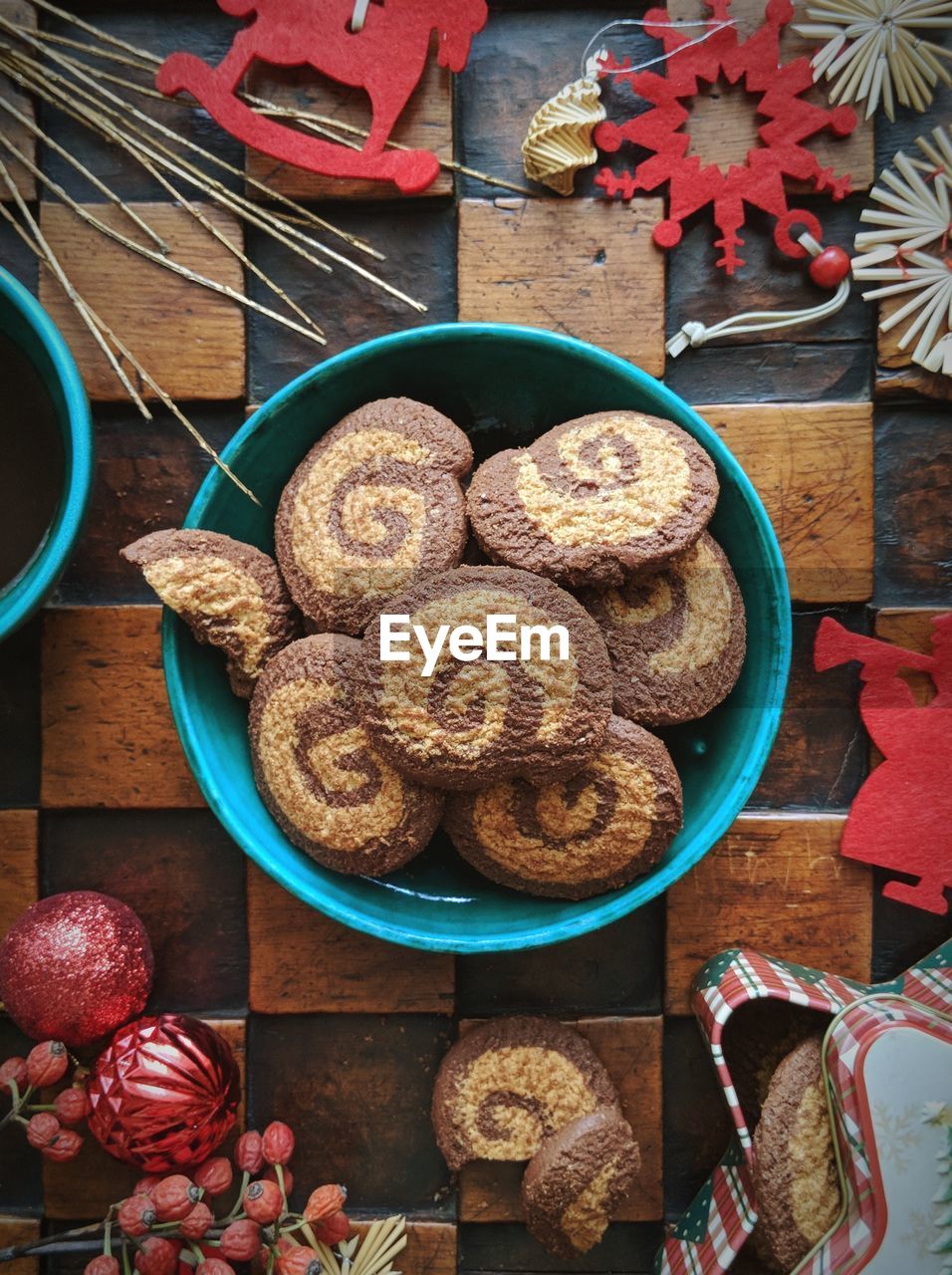 High angle view of cookies in bowl with christmas decoration on table
