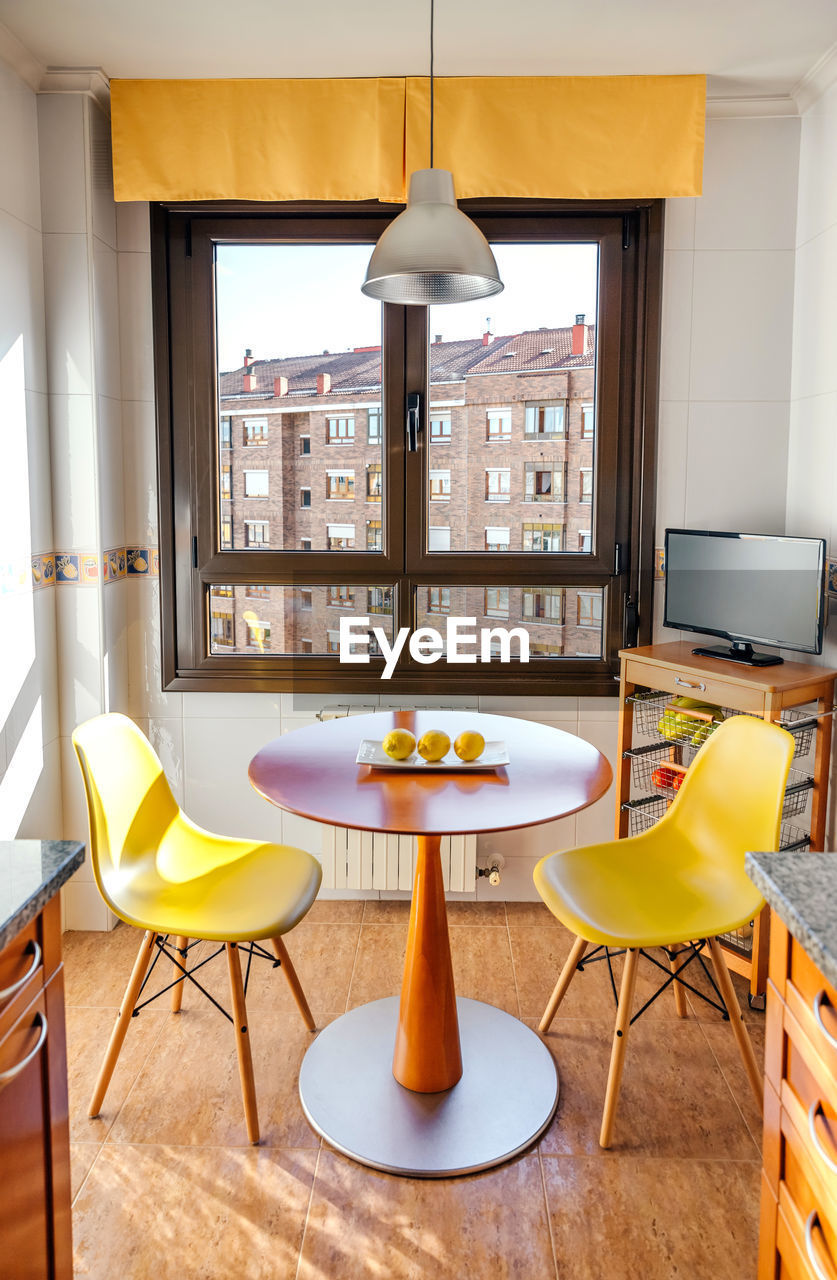 EMPTY CHAIRS AND TABLE AT HOME