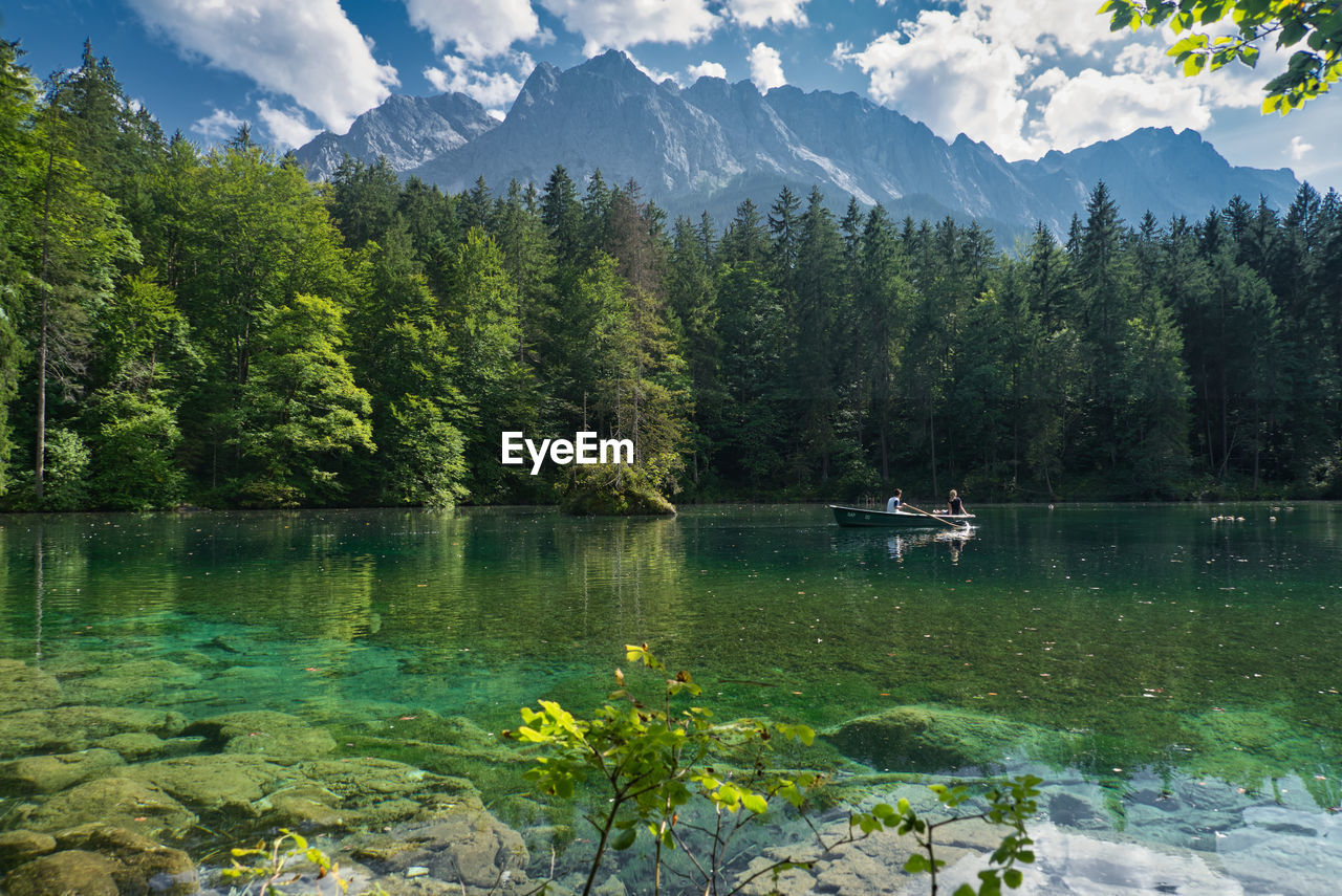 SCENIC VIEW OF LAKE AND MOUNTAINS