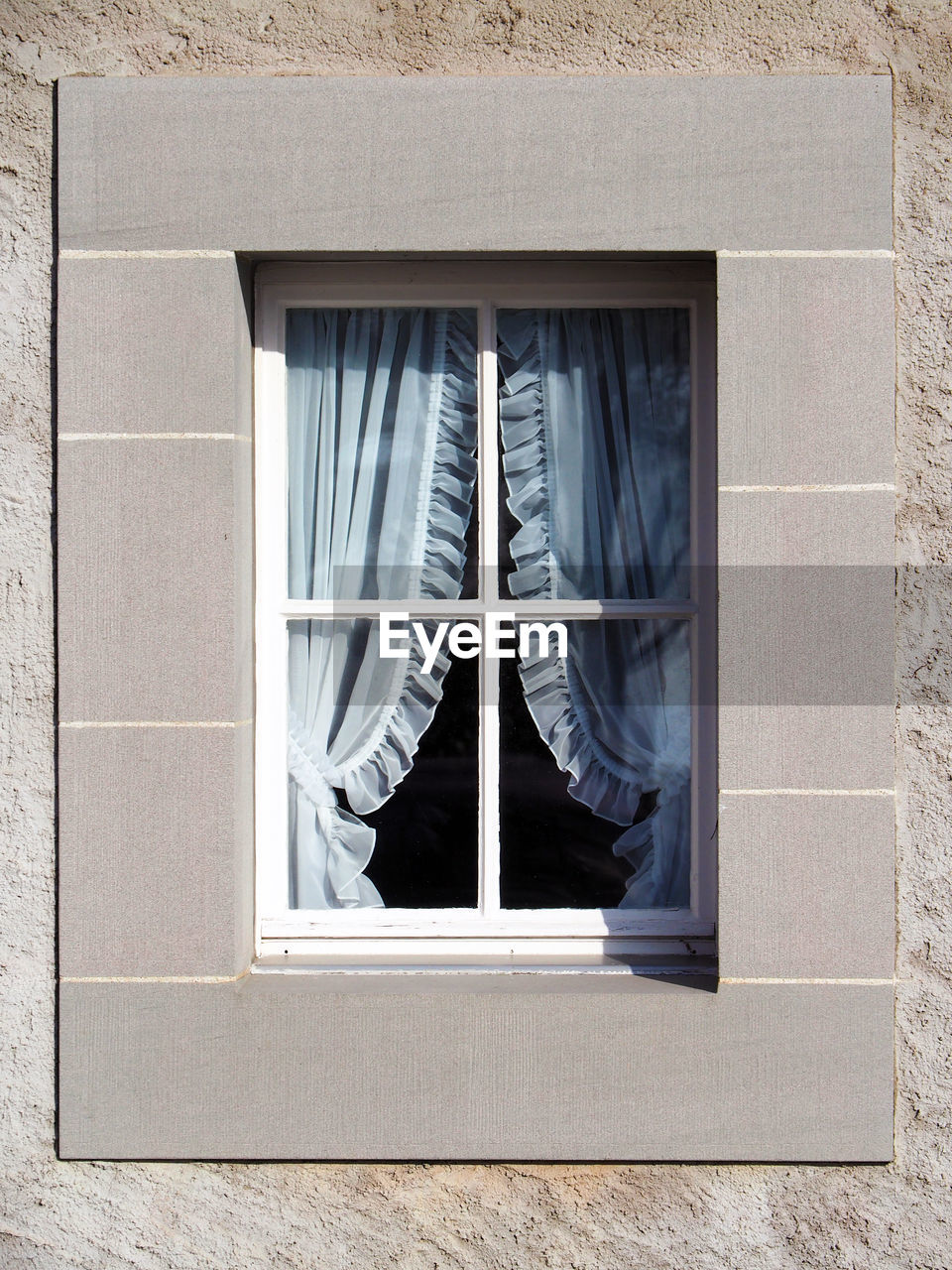 Curtain on window of house
