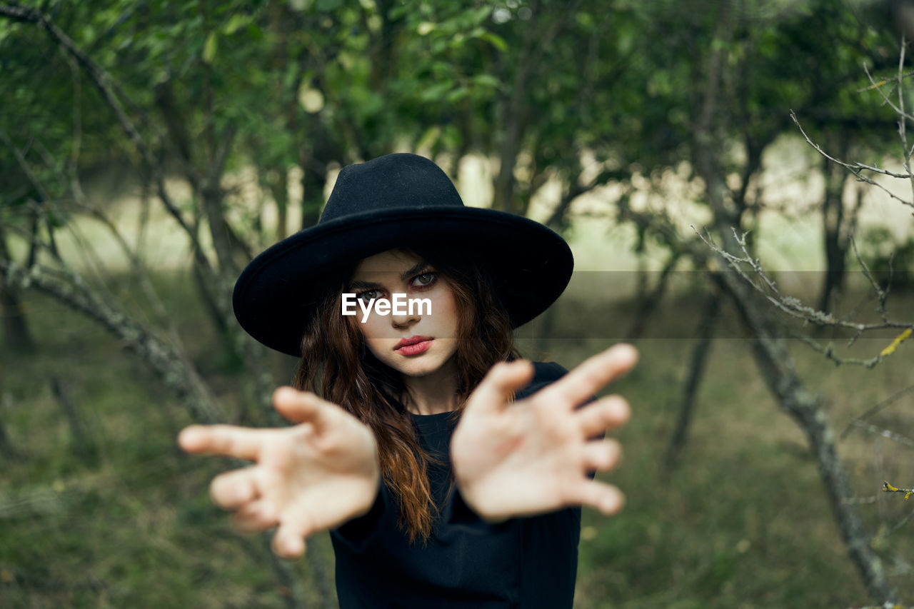 portrait of young woman wearing hat