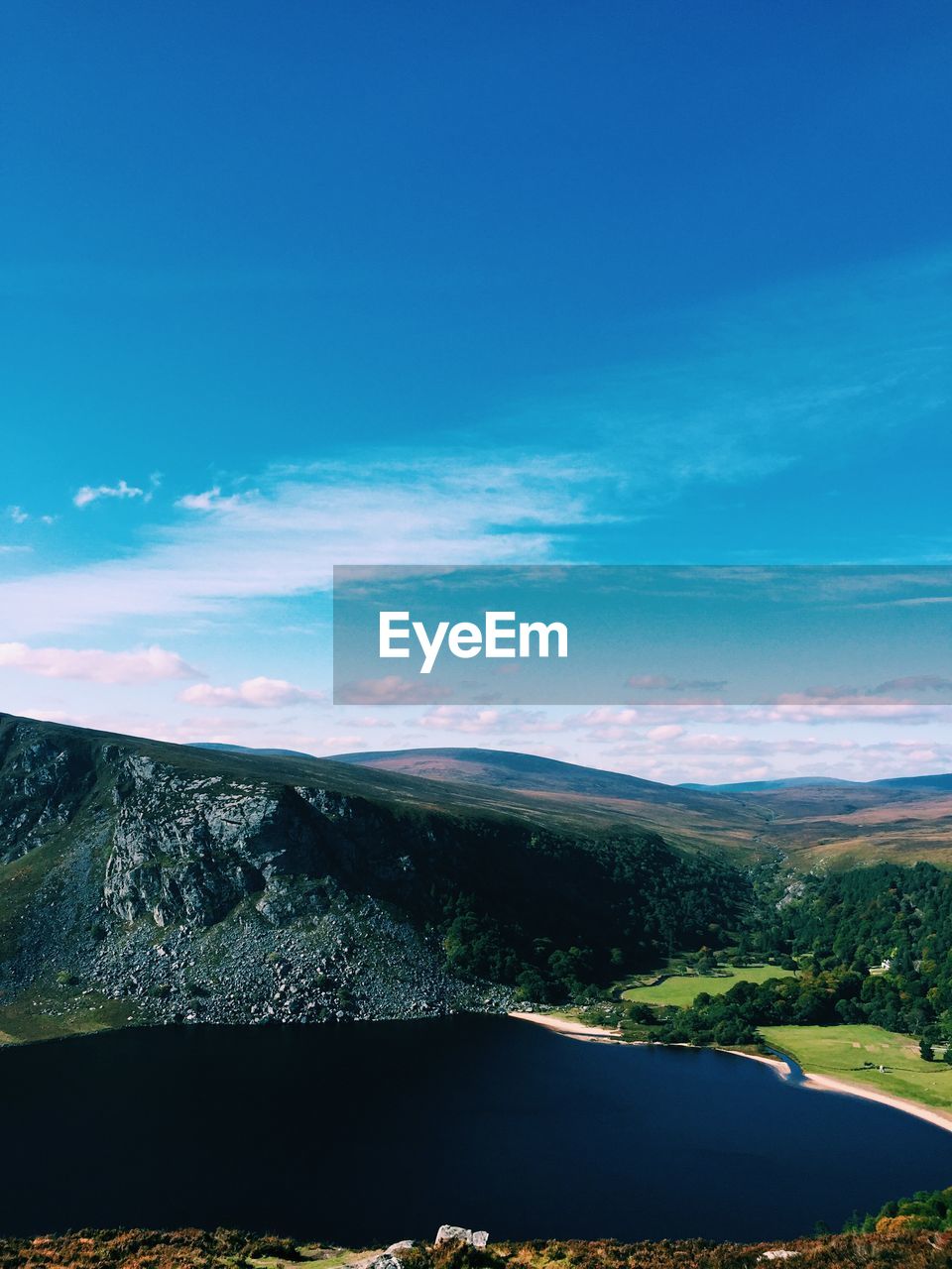 Scenic view of landscape against blue sky