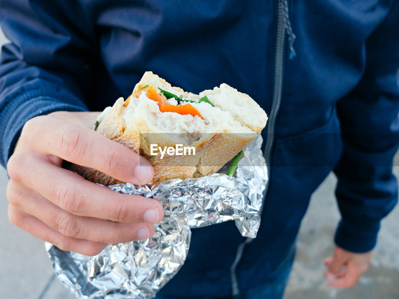 Close-up of man holding sandwich