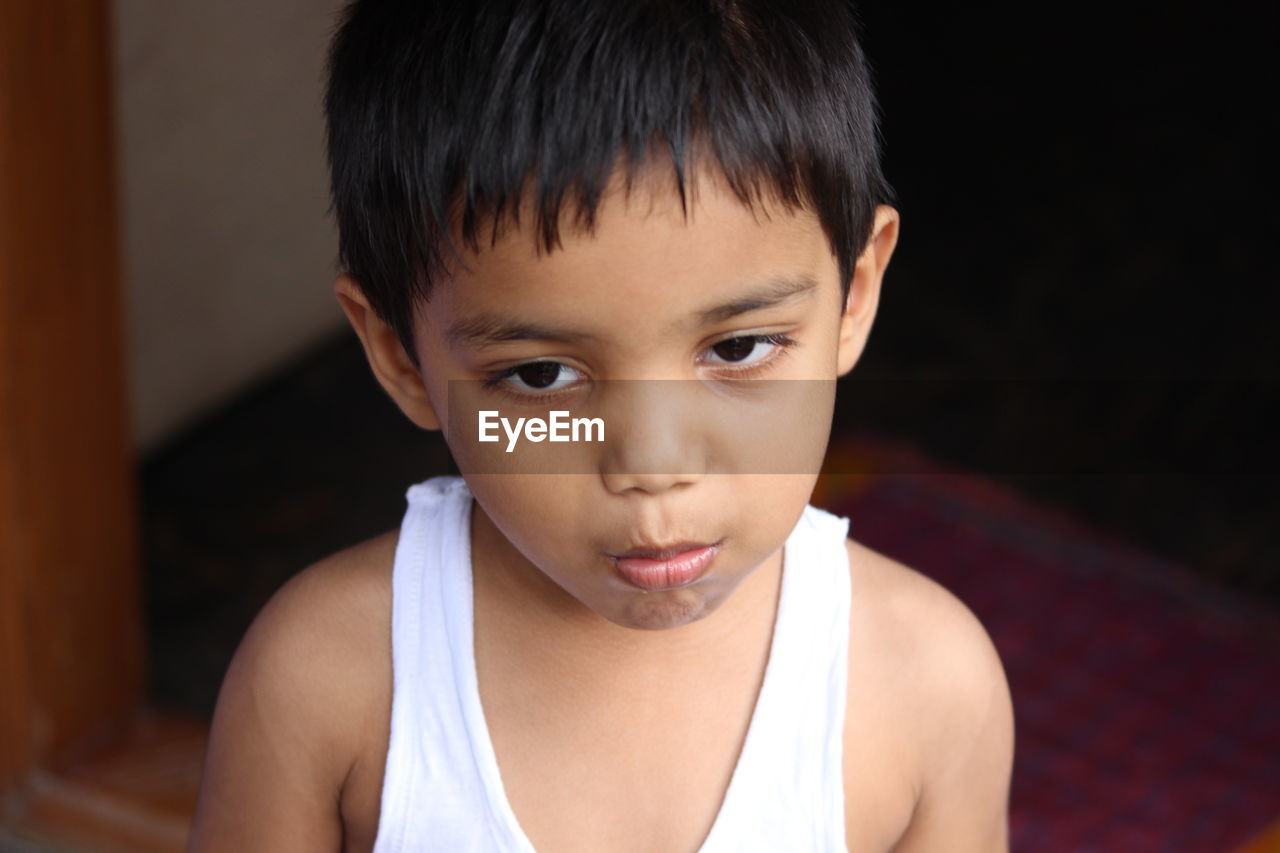 Close-up of boy at home