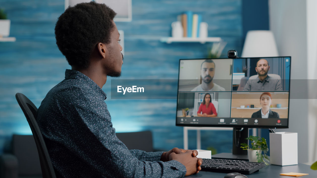 Man attending video call at home