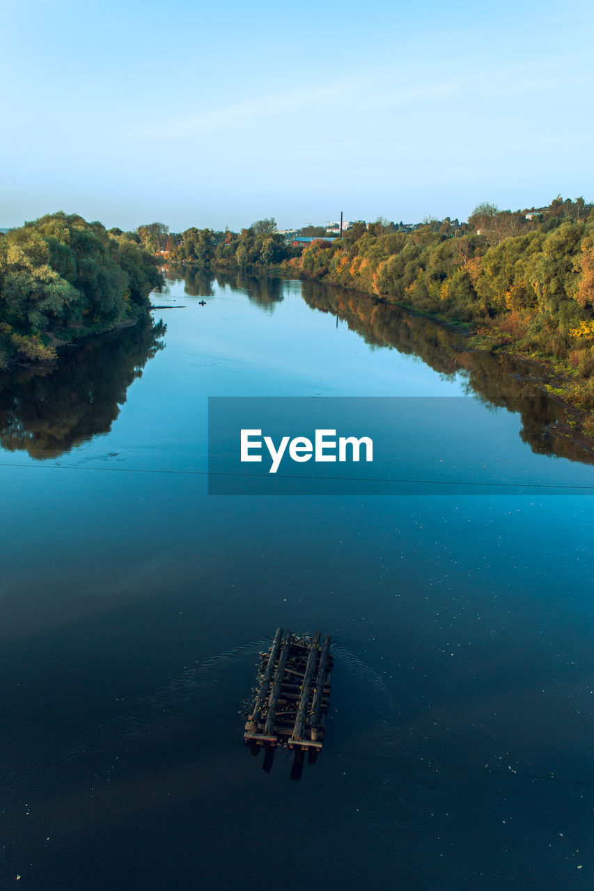 Aerial view to the klyazma river and wooden construction from auto and pedestrian bridge