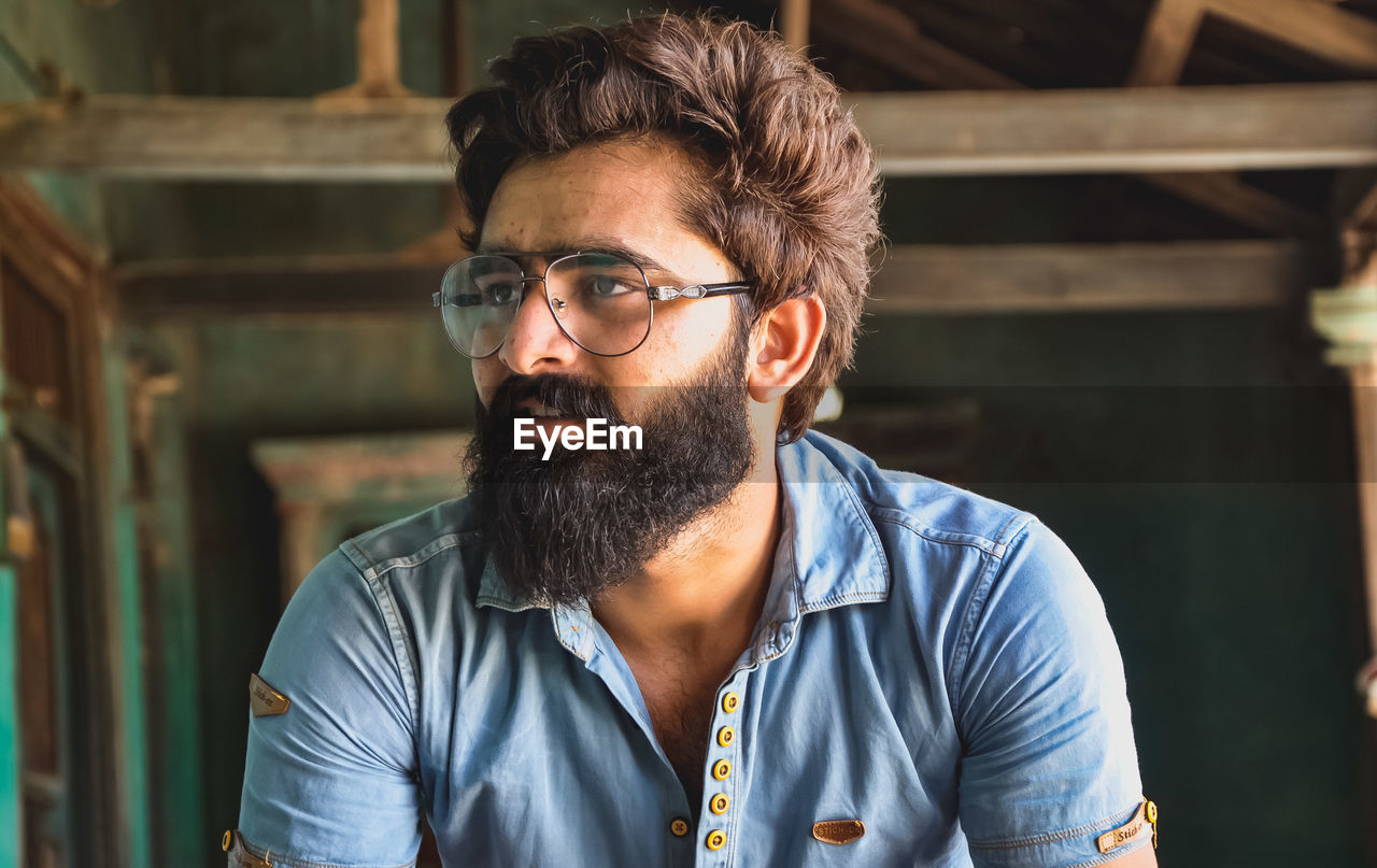 Close-up of bearded man with eyeglasses