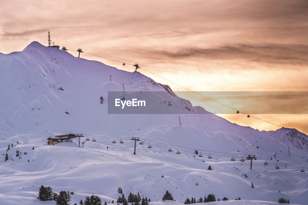 SCENIC VIEW OF SNOW COVERED MOUNTAIN AGAINST SKY