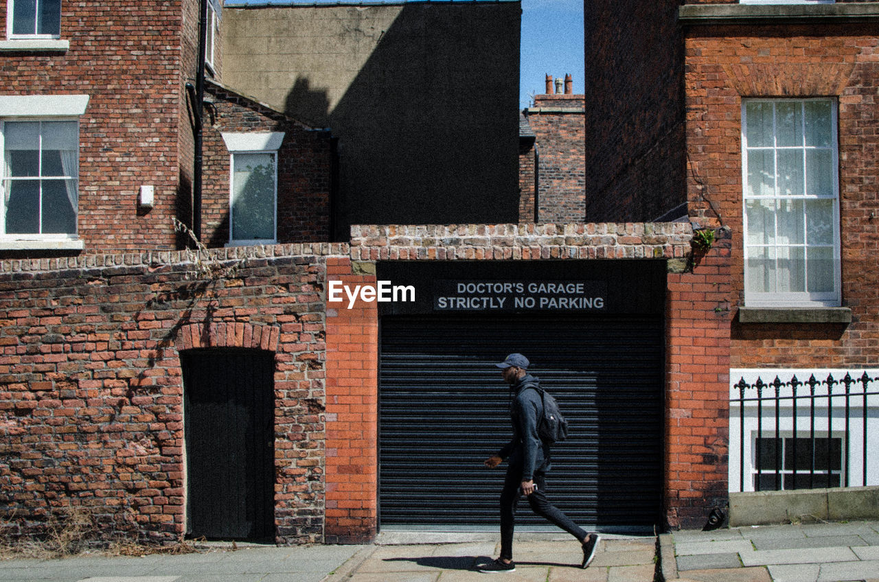 Full length of man walking on street