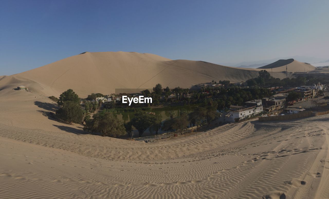 Scenic view of desert against clear sky