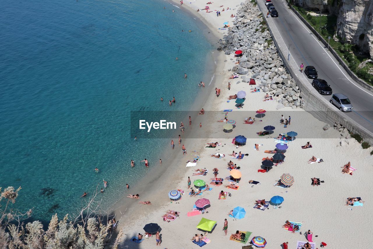 HIGH ANGLE VIEW OF CROWD AT BEACH