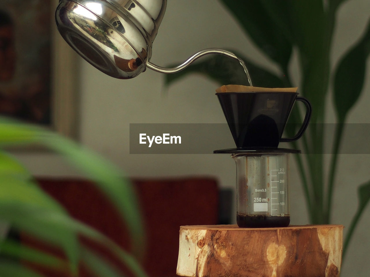 CLOSE-UP OF COFFEE CUP ON METAL