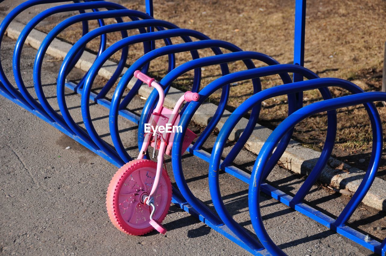 High angle view of bicycle wheel on rack
