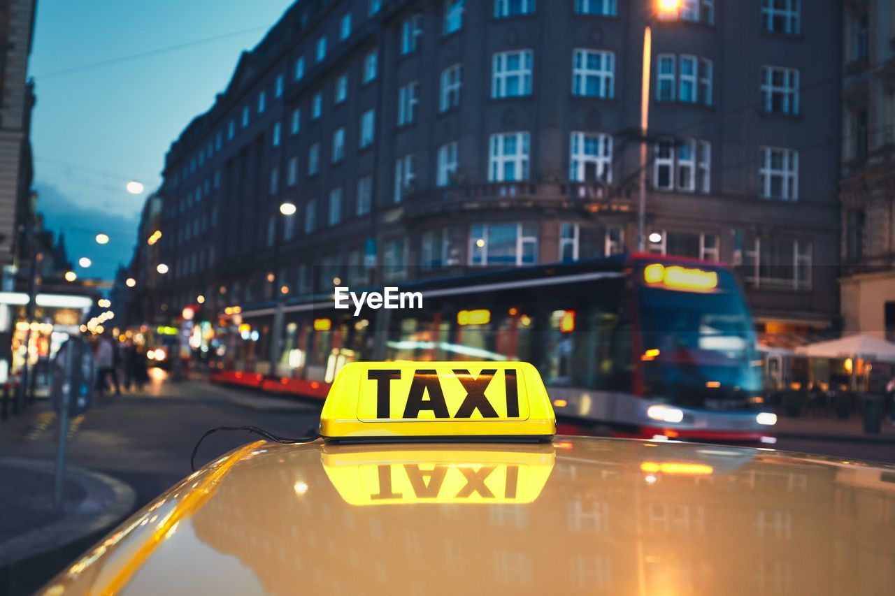 Close-up of taxi in city at night