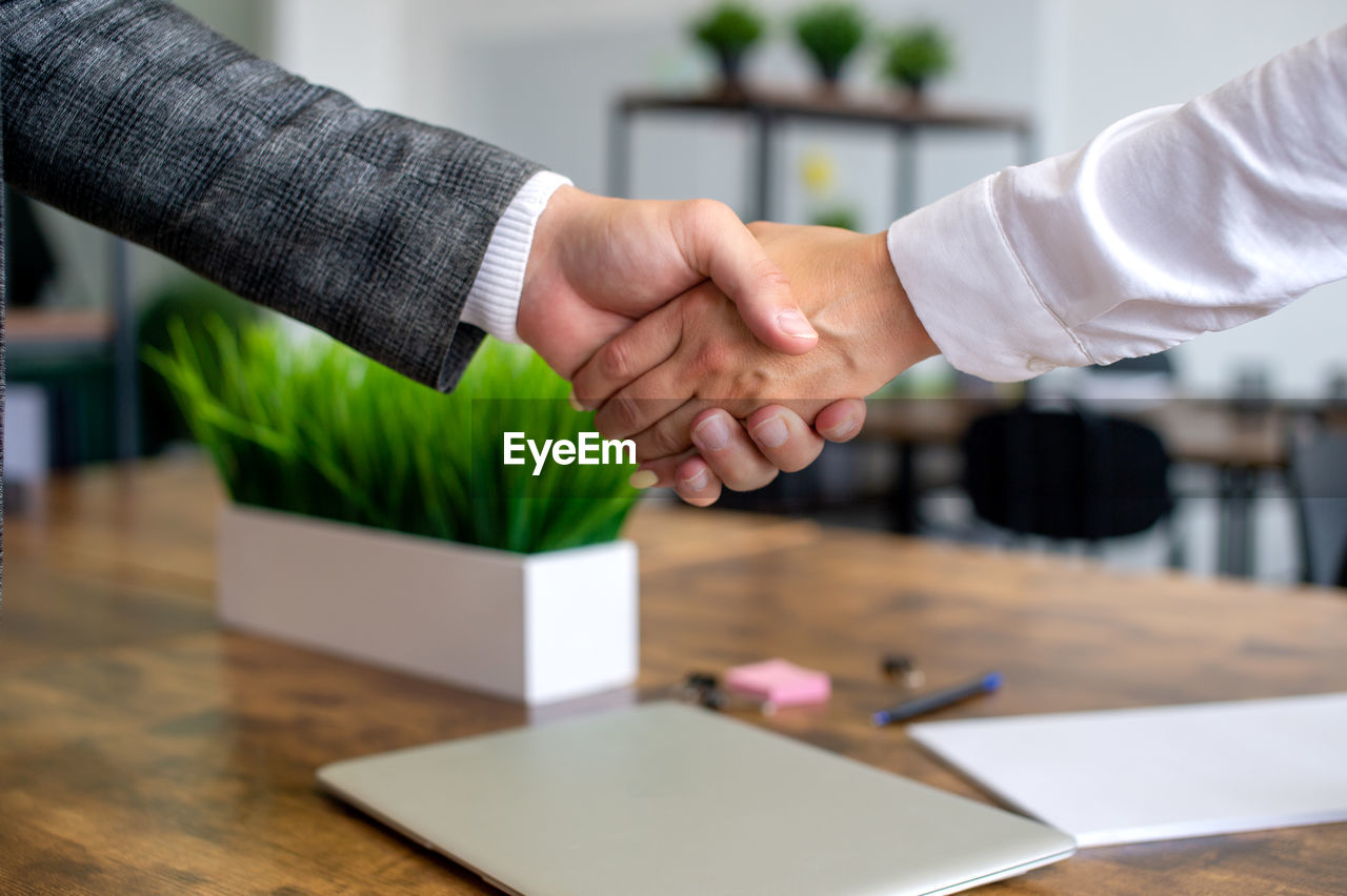 Close-up of business colleagues shaking hands