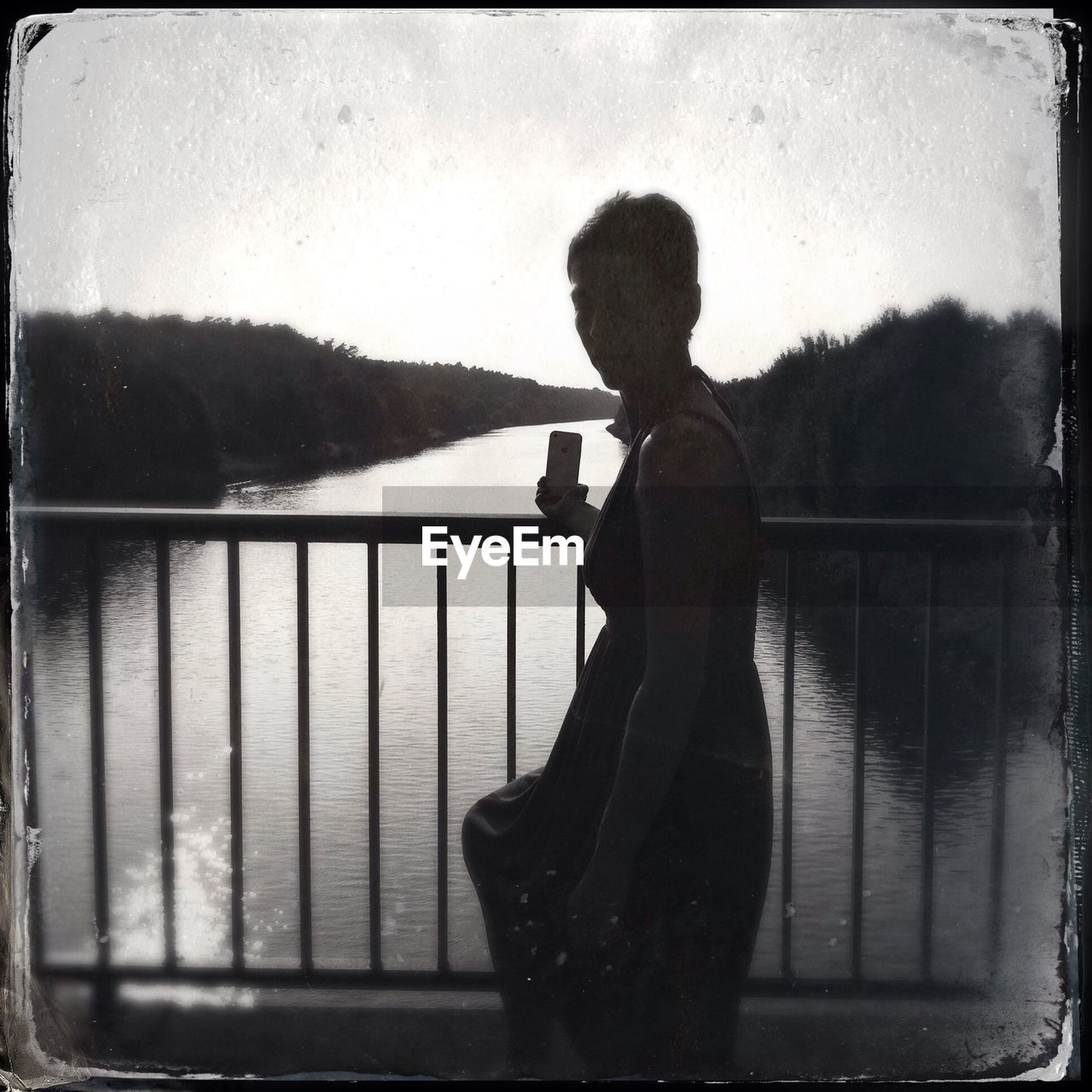 Woman standing on a bridge