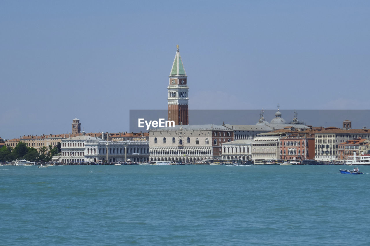 Piazza san marco by river against clear sky