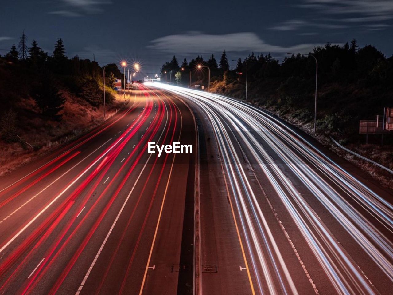 High angle view of light trails on highway at night