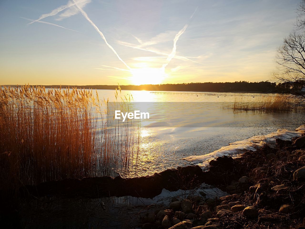 SCENIC VIEW OF LAKE DURING SUNSET