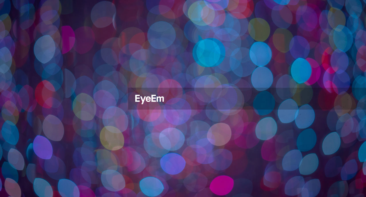 FULL FRAME SHOT OF ILLUMINATED LIGHTS AT NIGHT