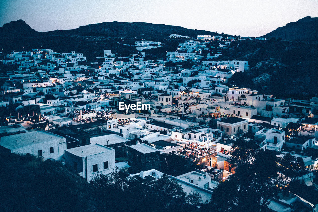 High angle view of illuminated cityscape at dusk