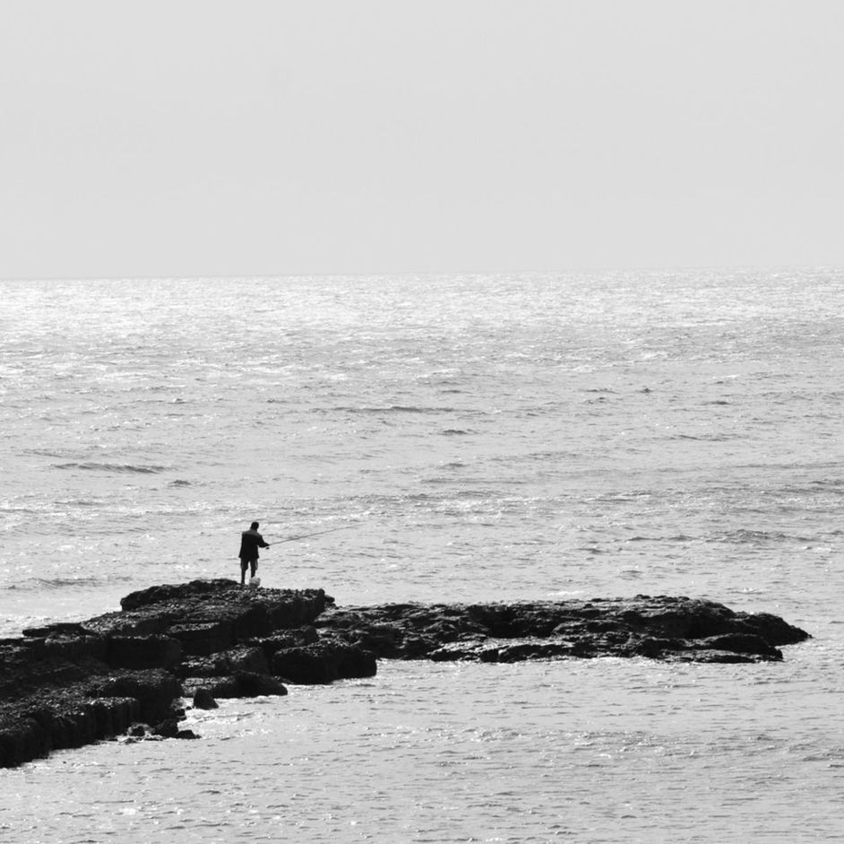 SCENIC VIEW OF SEA WITH TREES IN BACKGROUND