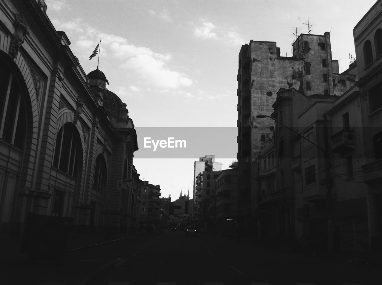 Black and white image of buildings and sky