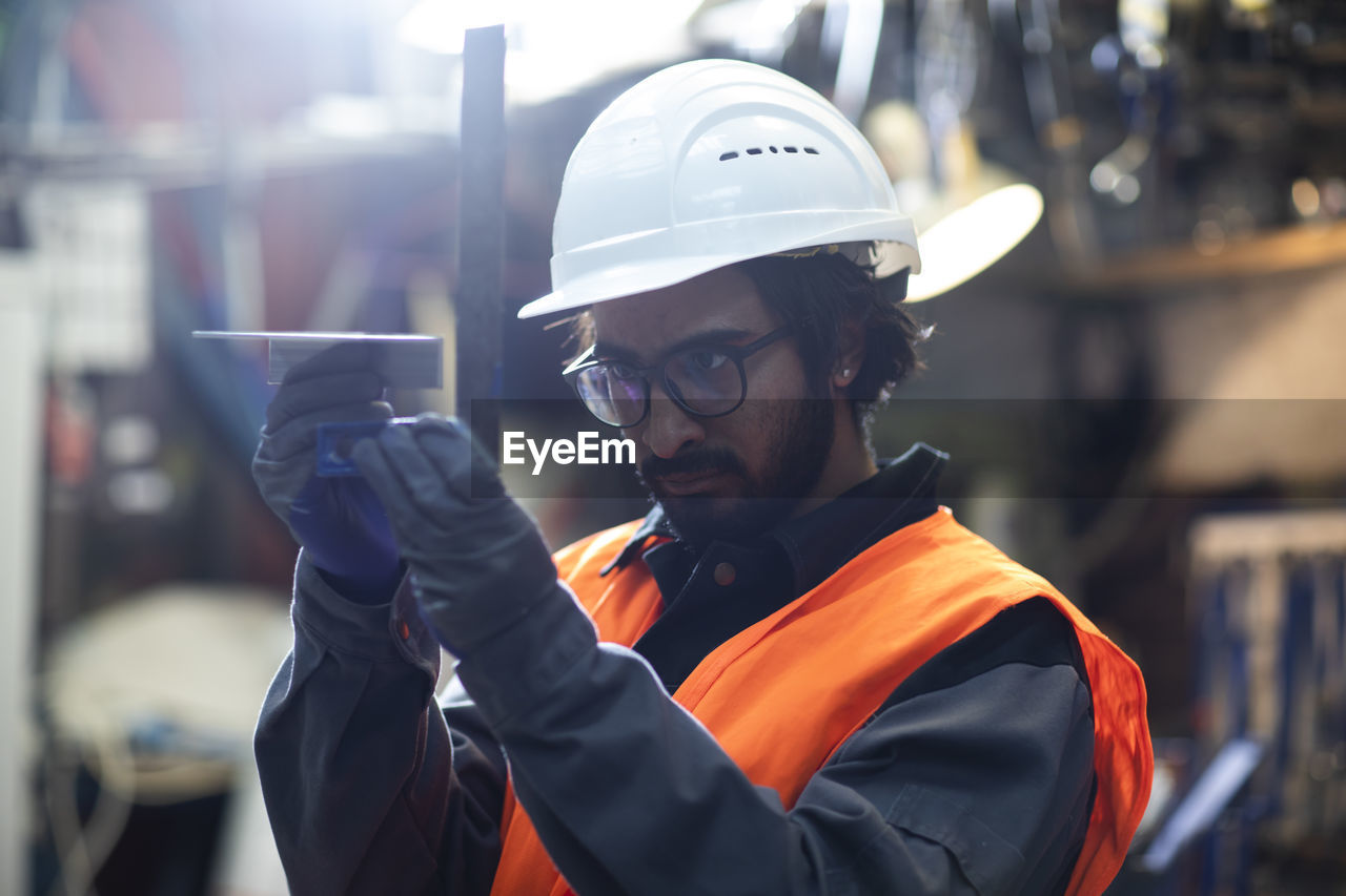 Young worker technician working in workshop