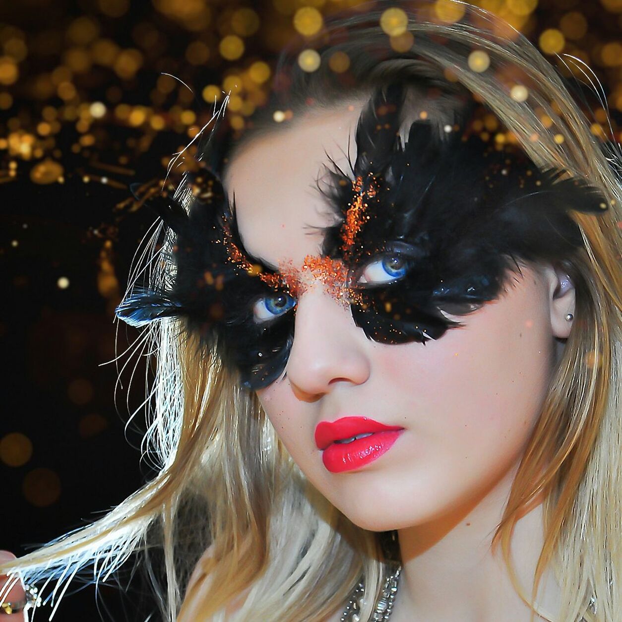 Close-up portrait of woman wearing venetian mask