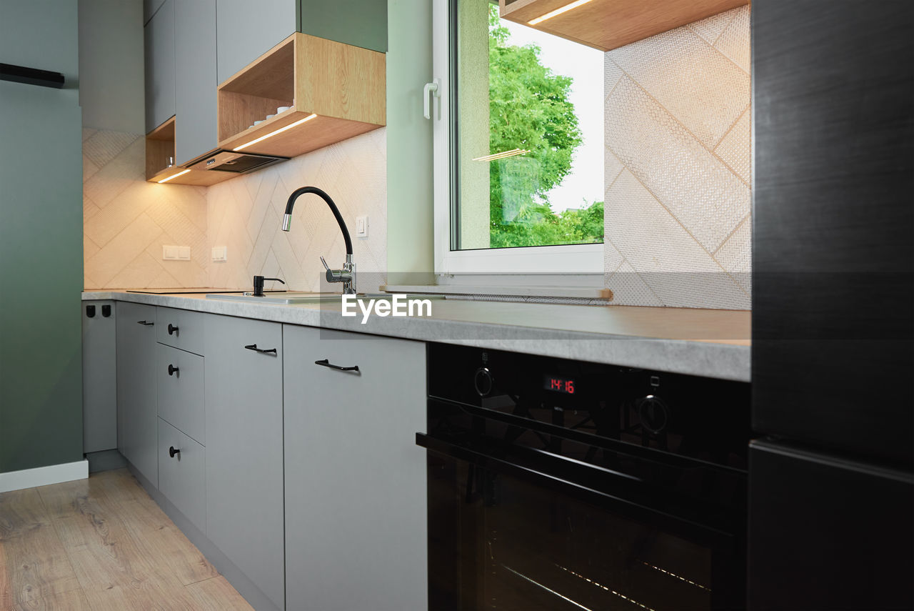 Modern kitchen interior with cabinets and empty countertop