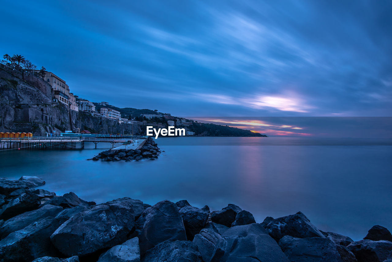 Scenic view of sea against sky at sunset