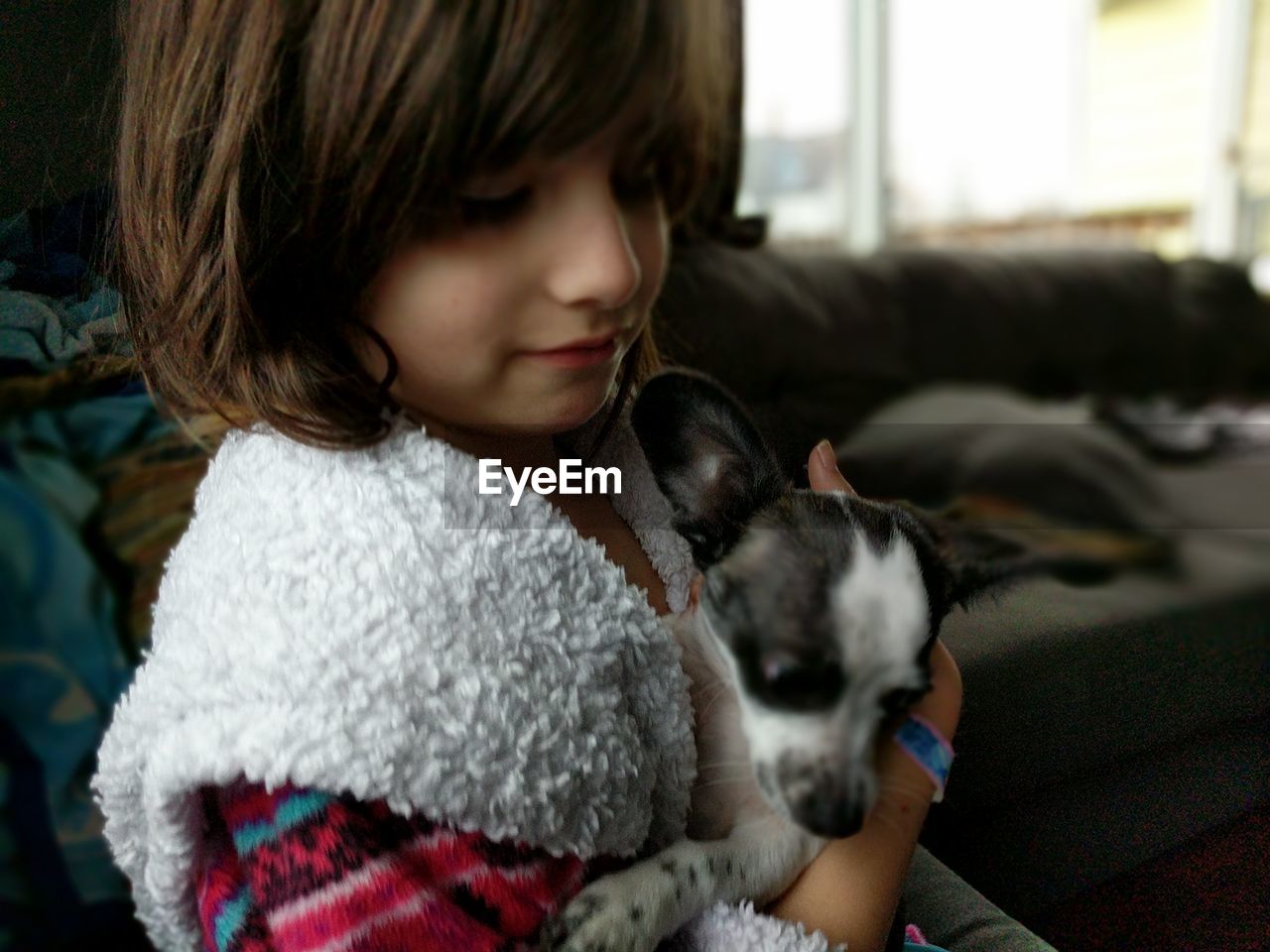 Girl with dog at home