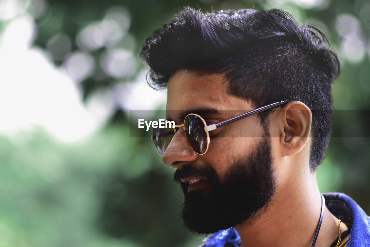 Close-up of young man wearing sunglasses