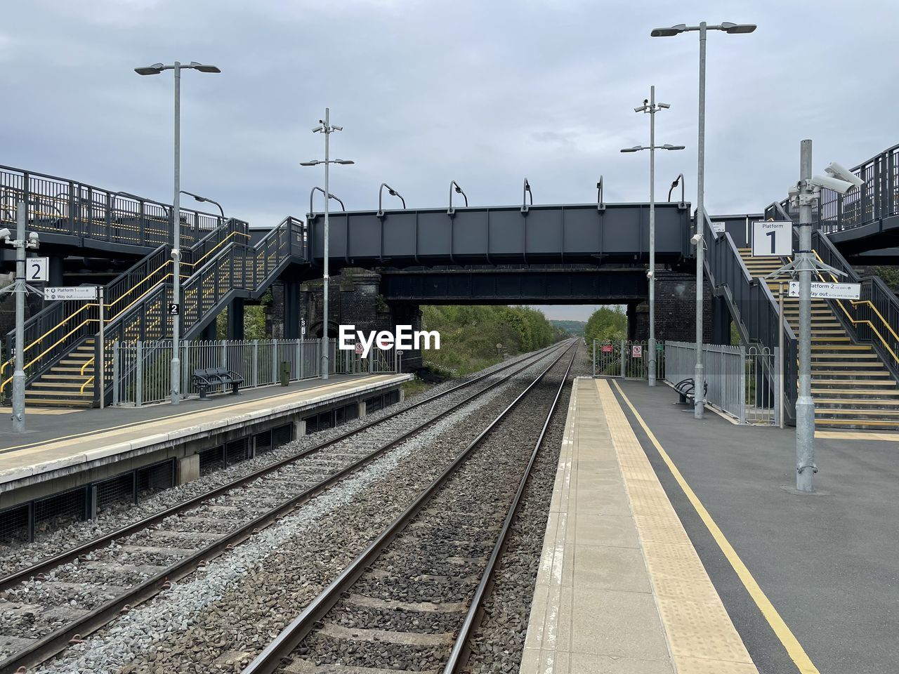 Railroad station platform against sky