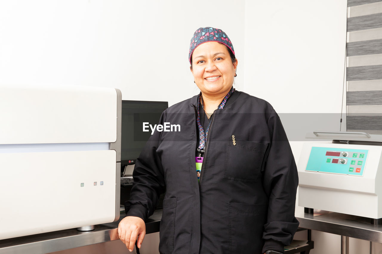 Female scientist working at the laboratory with a thermal cycler. polymerase chain reaction.