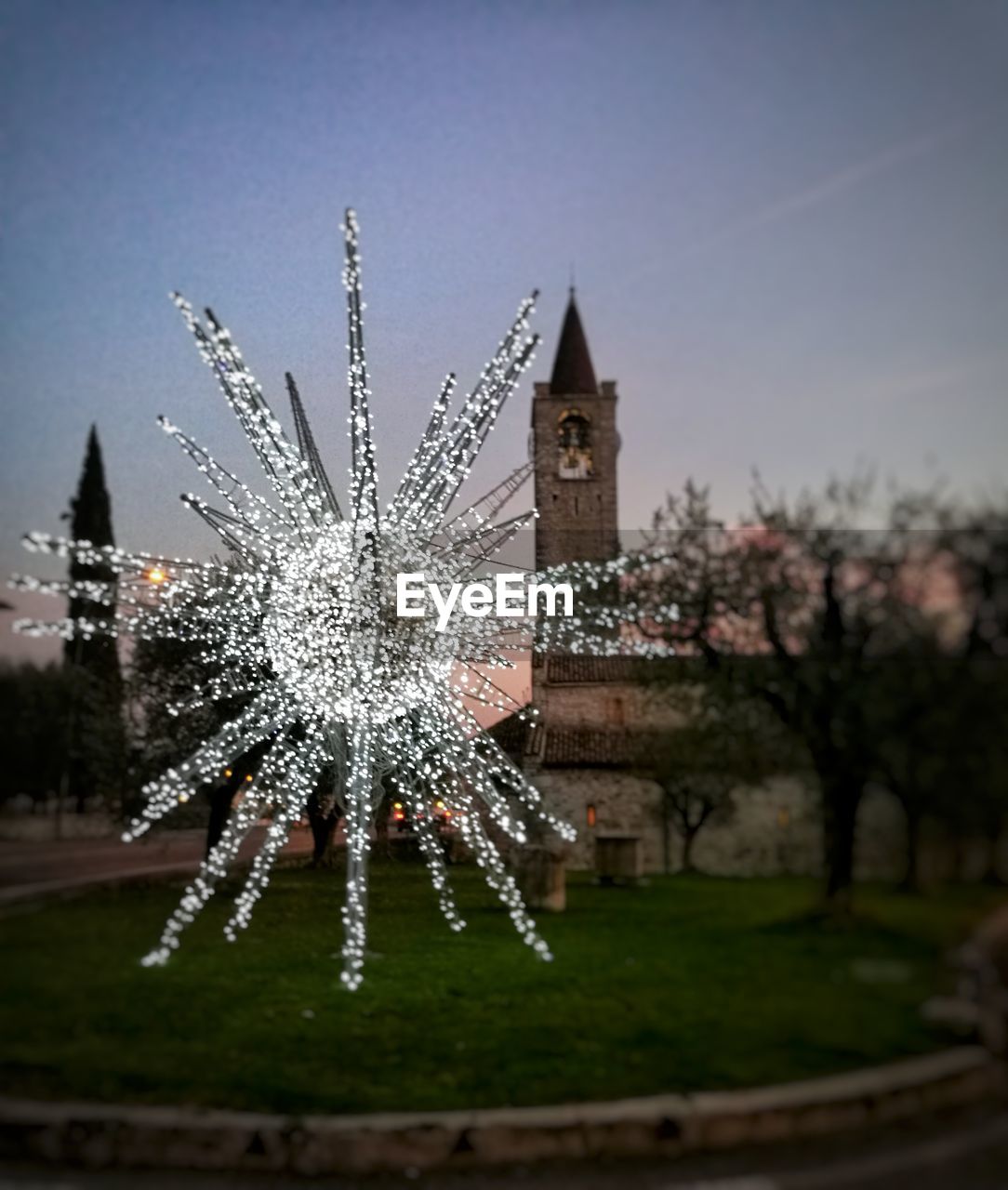 CHRISTMAS TREE AGAINST SKY AT NIGHT