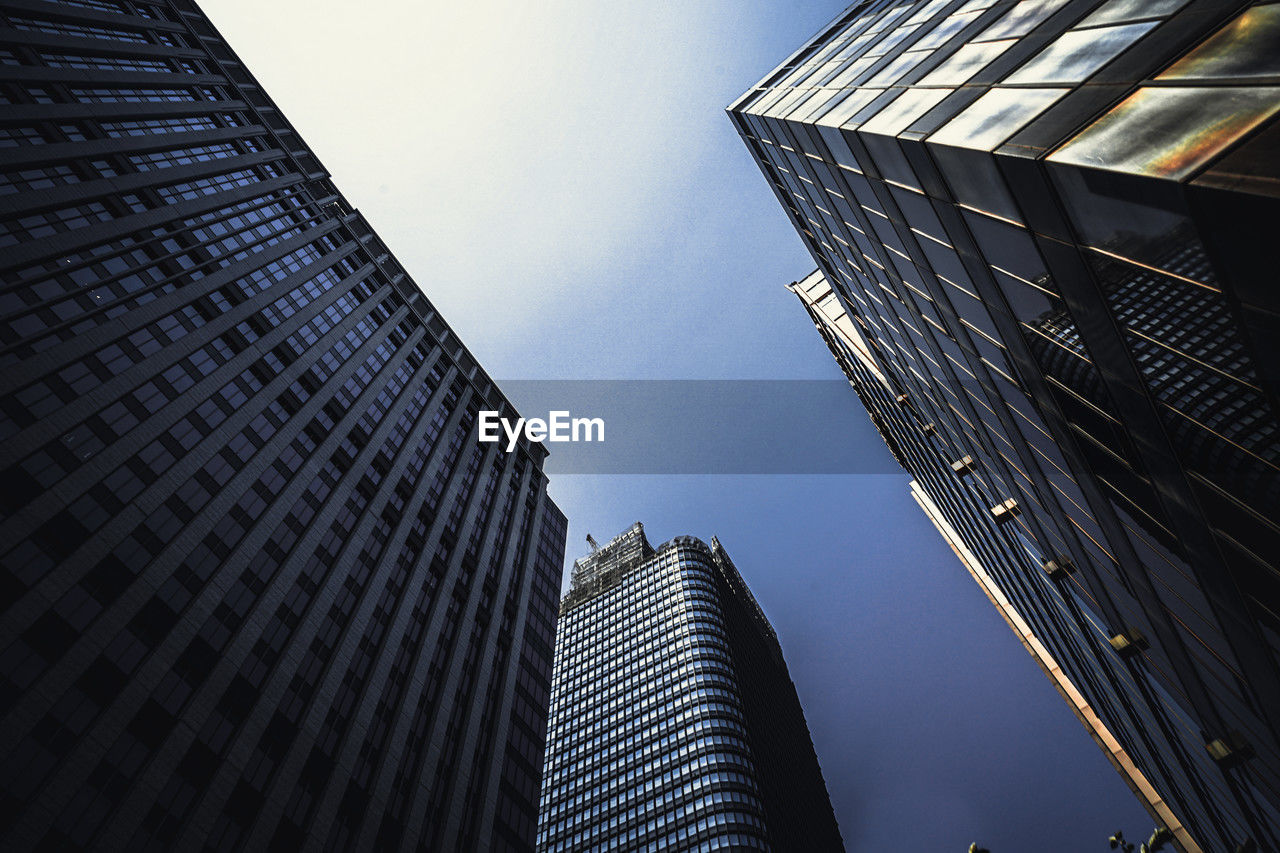 low angle view of skyscrapers against sky