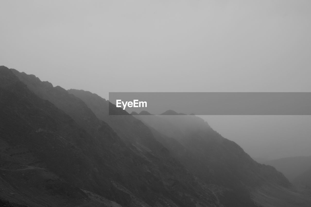 Scenic view of mountains against clear sky