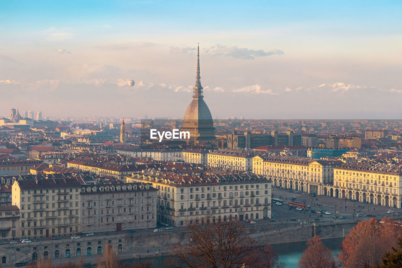 Aerial view of city buildings during sunset