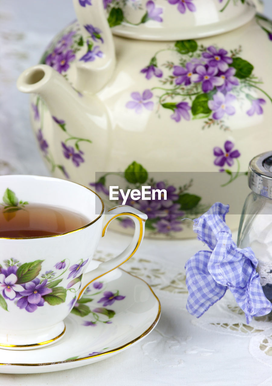 Close-up of elegant retro teapot on table