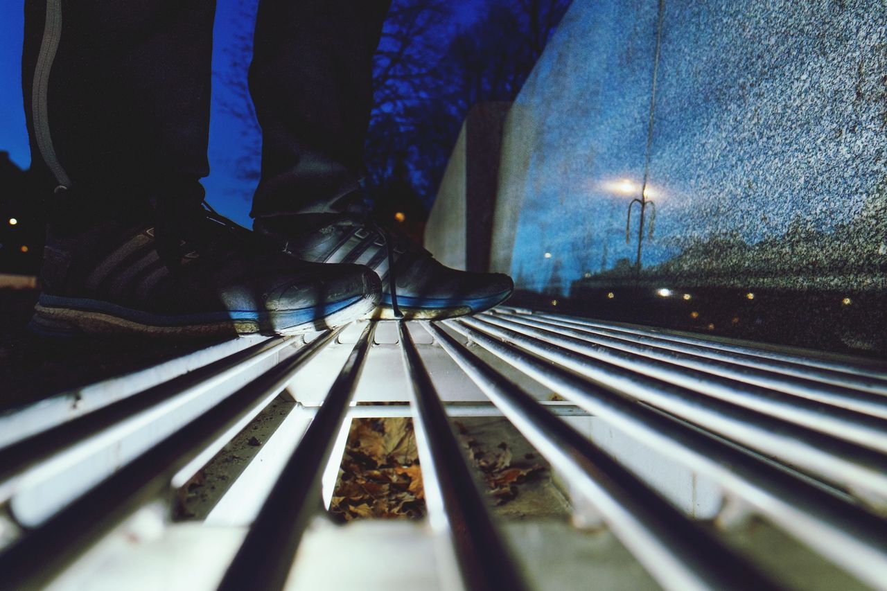 LOW SECTION OF MAN ON RAILROAD TRACKS