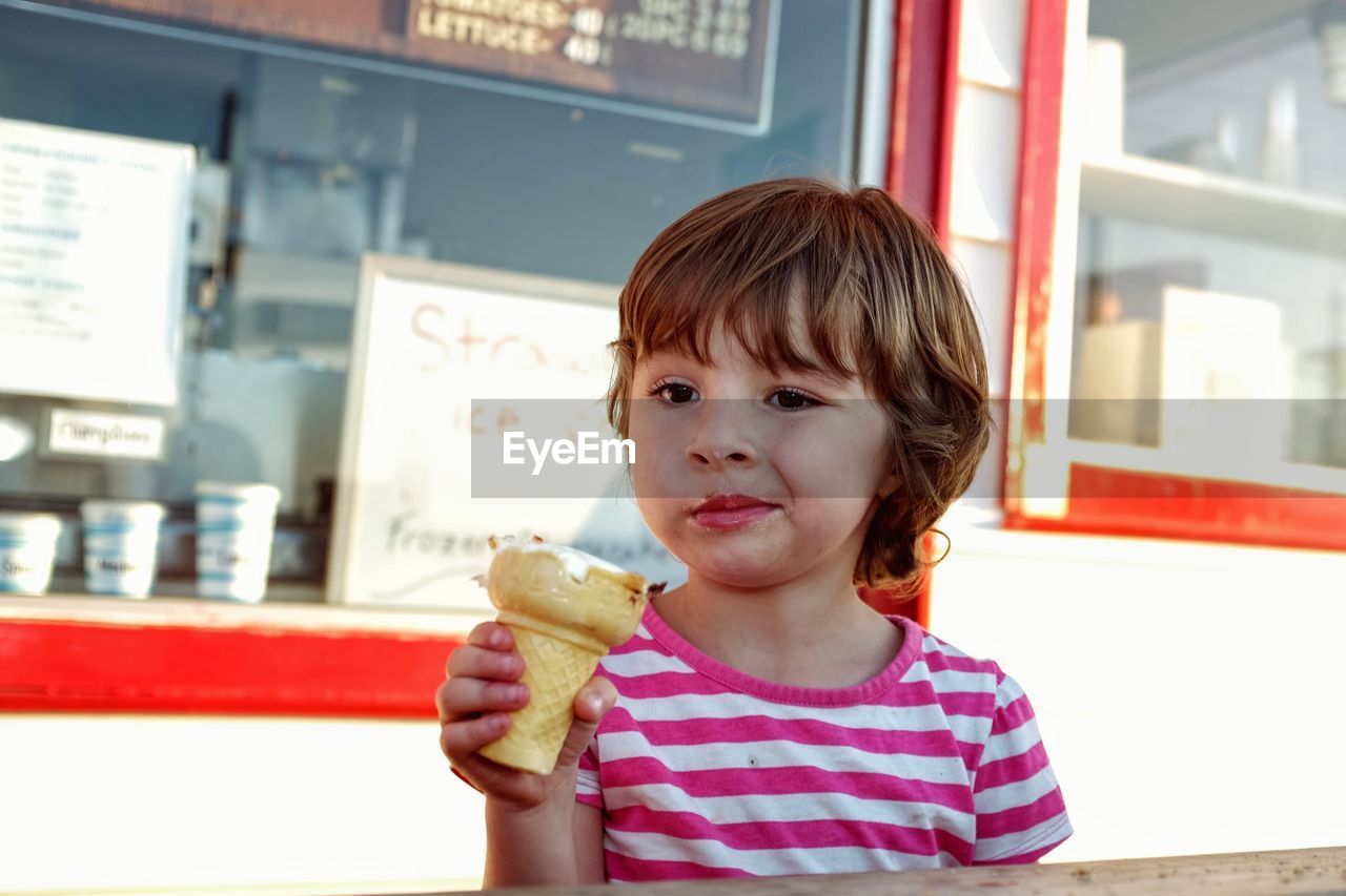 Girl holding ice cream cone