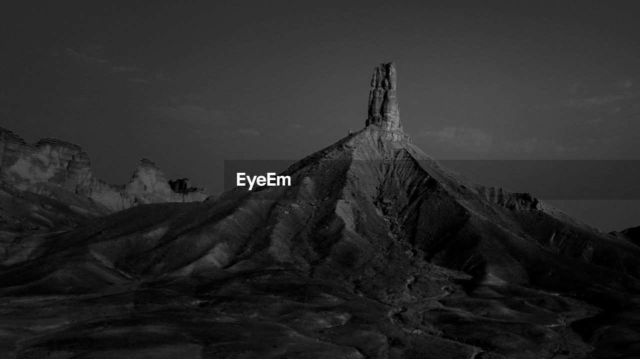 Scenic view of rock formation against sky