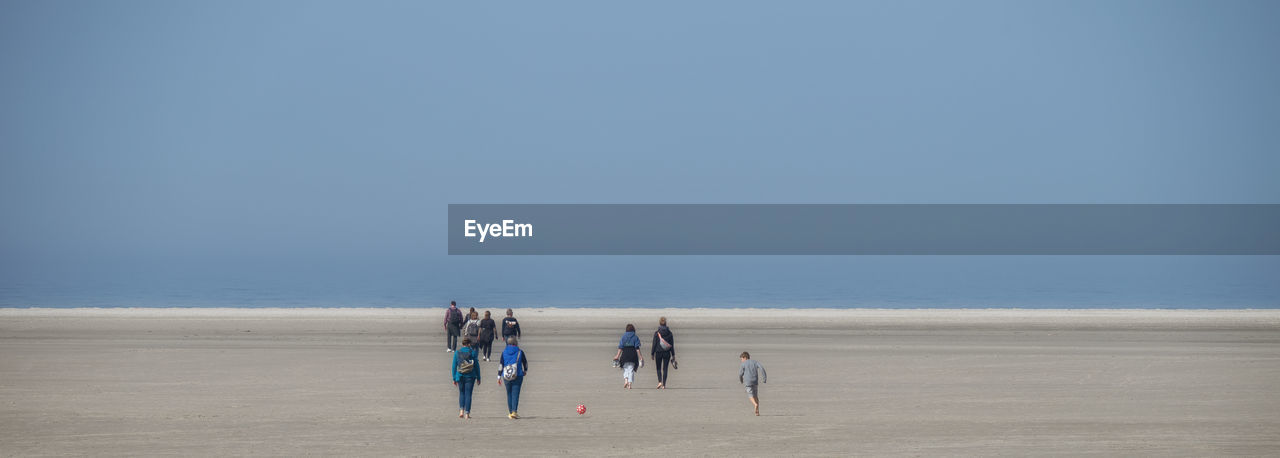 GROUP OF PEOPLE ON BEACH