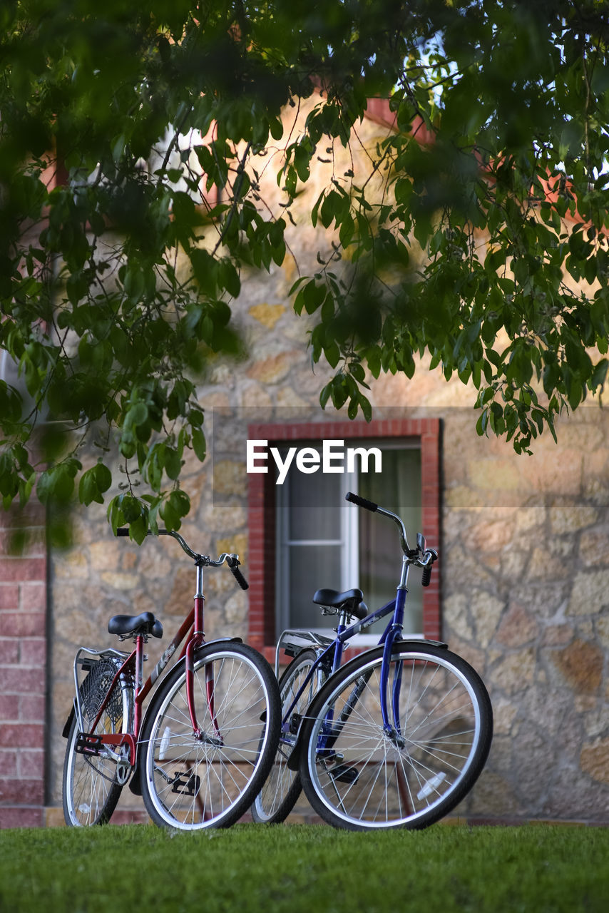 BICYCLE AGAINST BUILDING