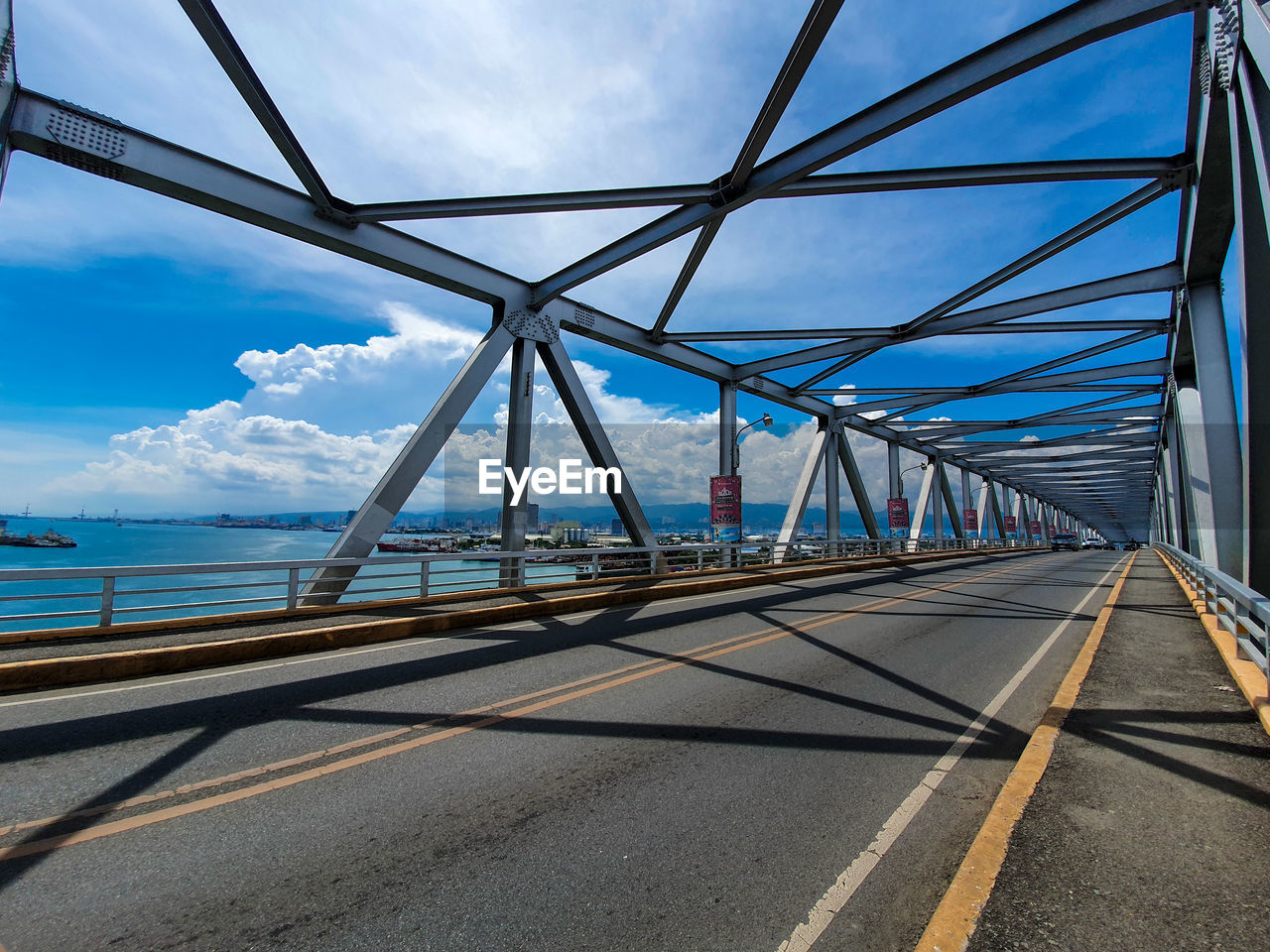 VIEW OF BRIDGE AGAINST CLOUDY SKY