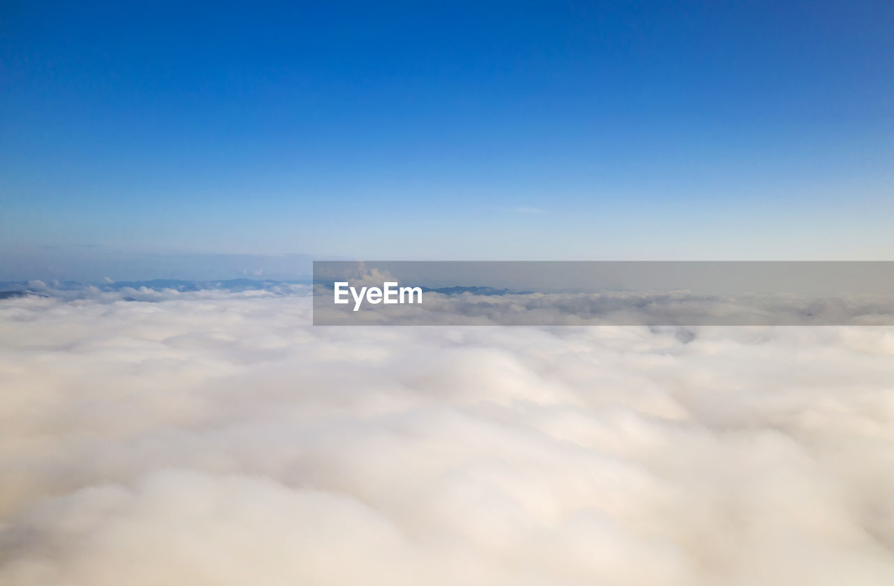 Aerial view beautiful of morning scenery sea of cloud and the fog flows on high mountains.