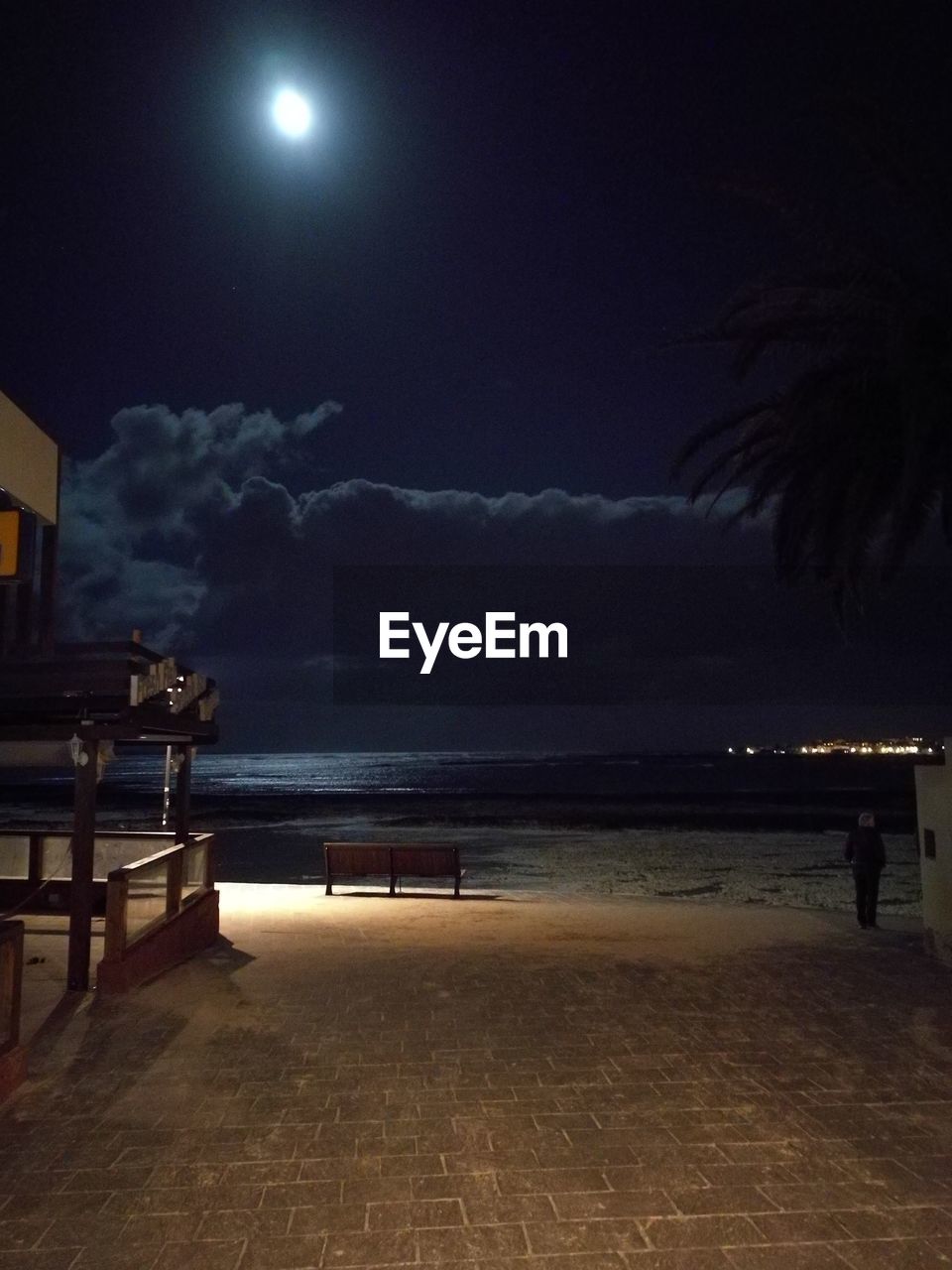 BEACH AGAINST SKY AT NIGHT