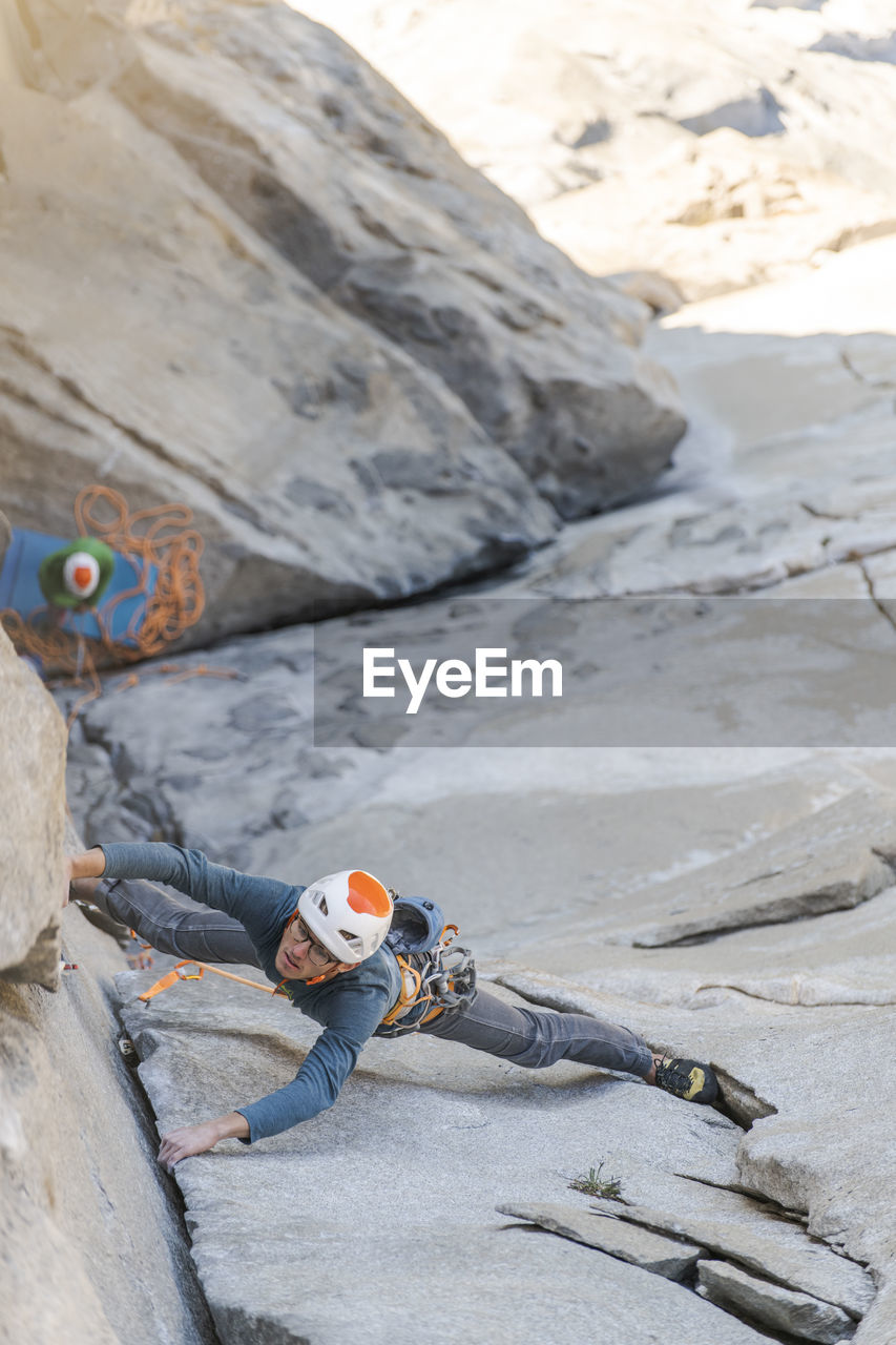 Rock climber crack climbing on the nose, el capitan in yosemite