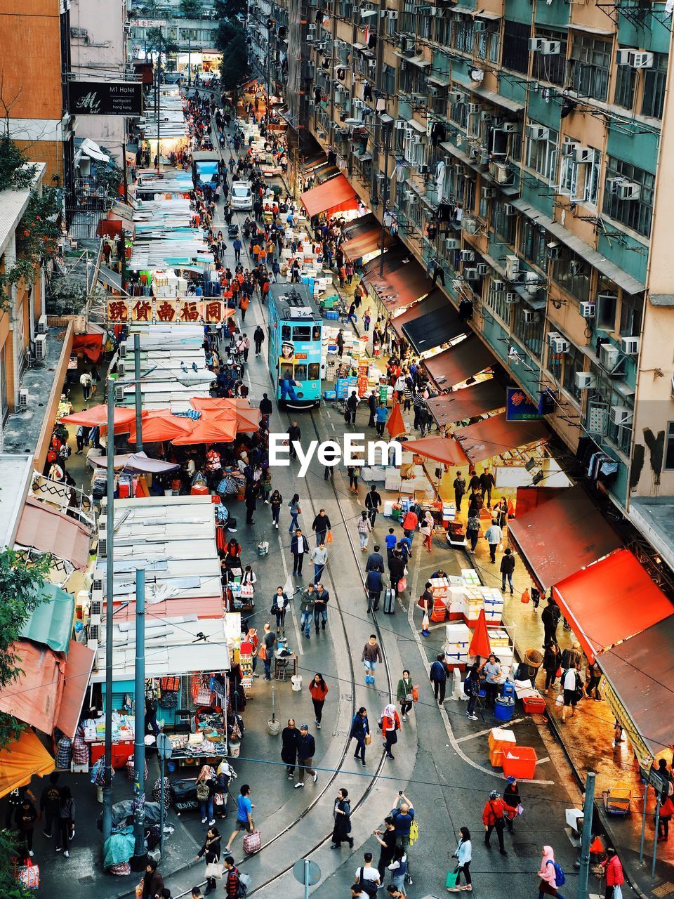 High angle view of people walking on city street